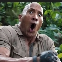 Dwayne Johnson looking at the camera with a wide-eyed, open-mouthed expression of extreme shock.