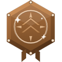 Bronze hexagonal badge with a central chevron symbol and decorative sparkles.