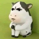 A 3D rendered cow with a grumpy, judgmental expression sitting on the floor against a green wall.