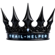 A dark metallic crown with sharp points and the text Trail-Helper written on the front band.