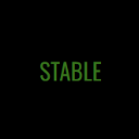The word STABLE written in glowing green capital letters against a black background.