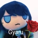 A blue-haired plush character holding a red rose with a smug expression and the text Gyaru below it.