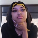 Woman resting her chin on her hand with a skeptical and unimpressed facial expression.