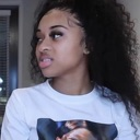 Young woman looking off-camera with a skeptical and unimpressed facial expression.
