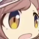 Anime girl with wide golden eyes and an open mouth expressing shock.