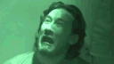 Markiplier with a panicked expression under a green night-vision filter.
