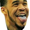 A man with a beard making a playful expression with his tongue stuck out.