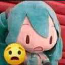 A teal-haired plush character with a wide-eyed, shocked expression next to a yellow emoji face with a similar expression.