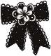 Three identical black bows with a central flower design arranged in a row.