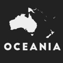 A white silhouette of the Oceania map with the text Oceania underneath on a black background.