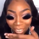 Person with a digital filter making their eyes appear as large, solid black voids.