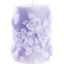 A light purple pillar candle decorated with raised rose carvings.