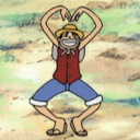 Monkey D. Luffy smiling and forming a heart shape with his arms above his head.