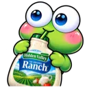A cute green frog with large blue eyes happily drinking from a bottle of ranch dressing.