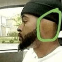 A man in a beanie turns his head away with a green circle drawn around his ear to highlight that he is not listening.