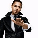 J. Cole holding his hand out in a stop gesture while looking directly at the camera.
