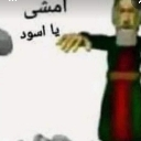 A 3D character in a T-pose with Arabic text overlaid on a low-quality background.