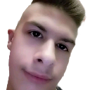 Young man with a short haircut looking at the camera with a smug, slightly distorted smirk.