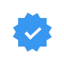 Blue twelve-pointed star badge with a white checkmark in the center.