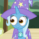 A blue unicorn wearing a purple wizard hat with stars looks forward with wide, curious eyes.