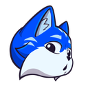 A blue fox with white fur on its face looking surprised with wide eyes.