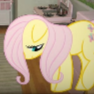 Fluttershy the yellow pony looking down with a suspicious and unimpressed expression.