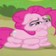 A distorted pink pony face with a smug, melting expression and heavy, dark eyebrows.