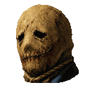 Burlap sack mask with stitched eyes and mouth staring directly forward.