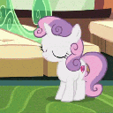 A white pony with a pink mane sways back and forth with its eyes closed.