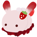 A small round pink creature with a strawberry on its head looking forward.