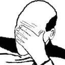 Man covering his face with his hand in a gesture of frustration.