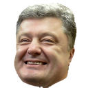 A man with graying hair wearing a wide, toothy, and mischievous grin.